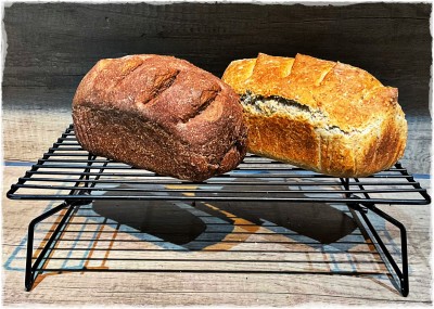 Two loaves on a cooling rack